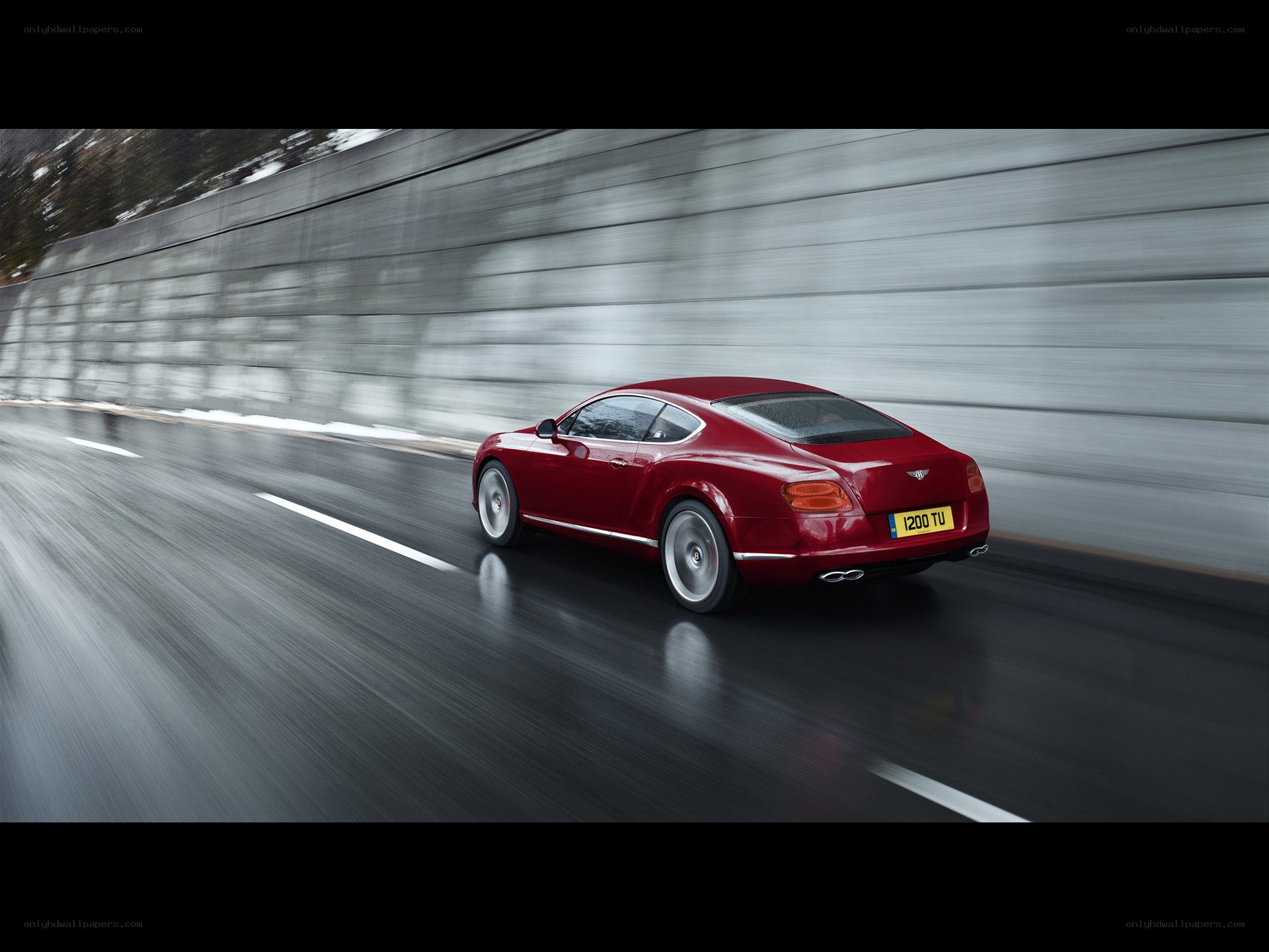 Red Bentley speeding on road
