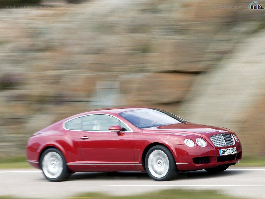 Red Bentley speeding on road