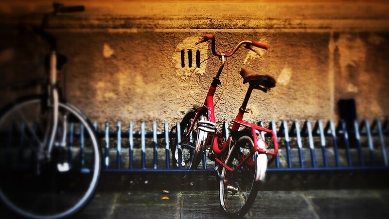 Red bicycle against a wall