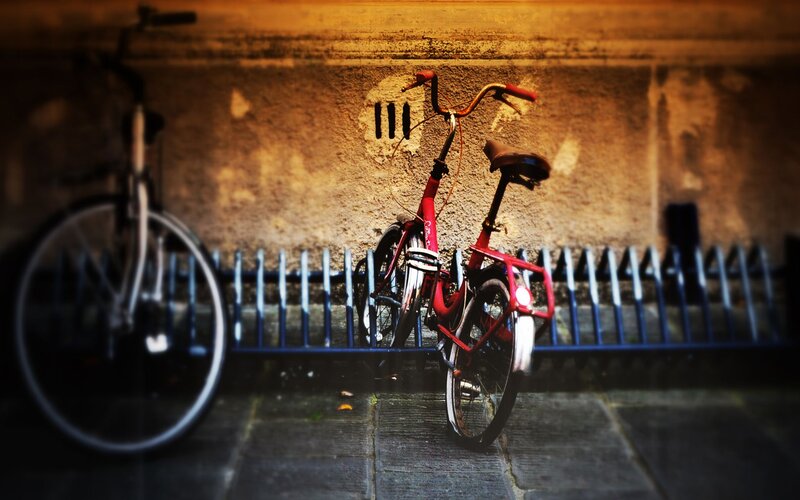 Red Bicycle Against Wall — Dramatic