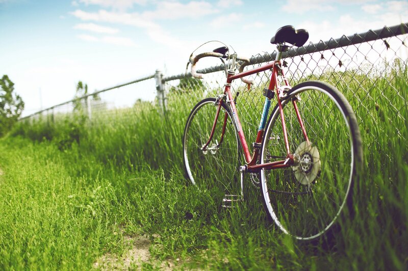 red bicycle in grass