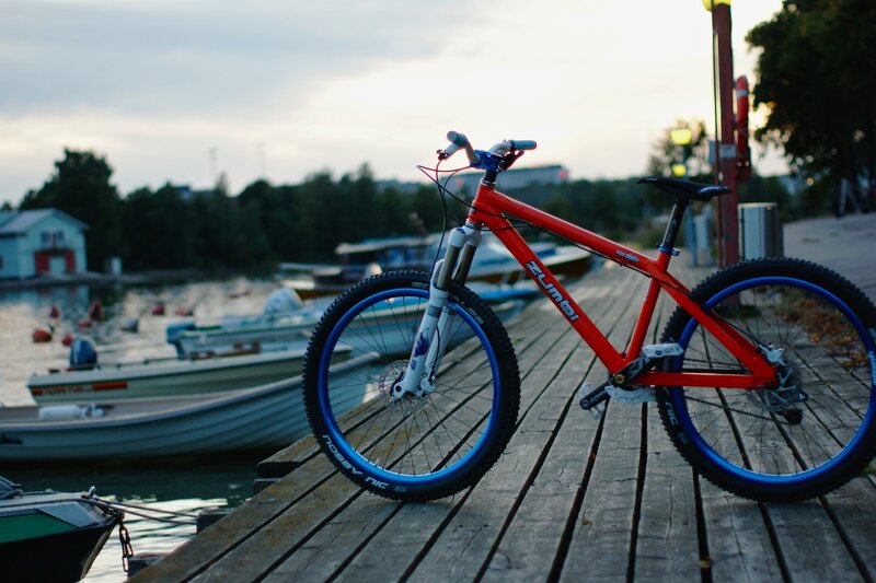 red bike on wooden dock