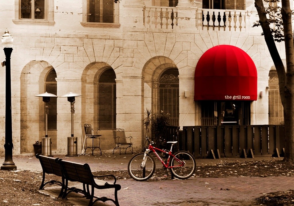 Red bike outside restaurant