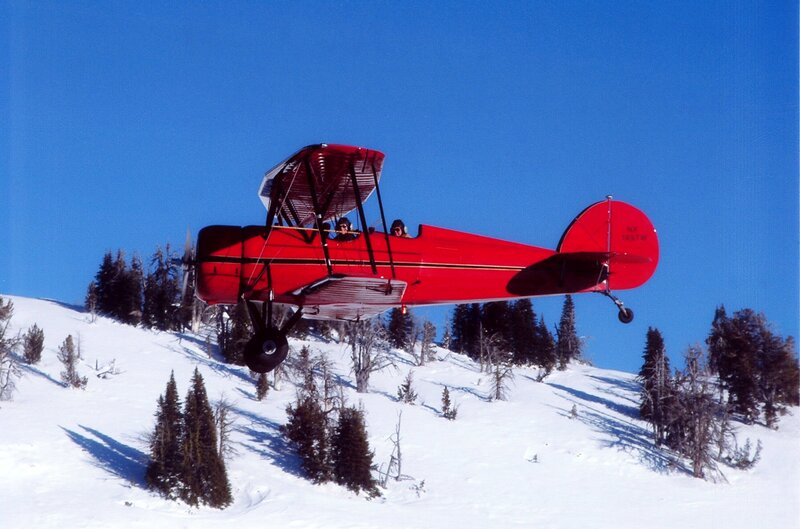 Red Biplane Flying