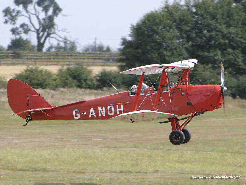 Red Biplane in Flight — Active