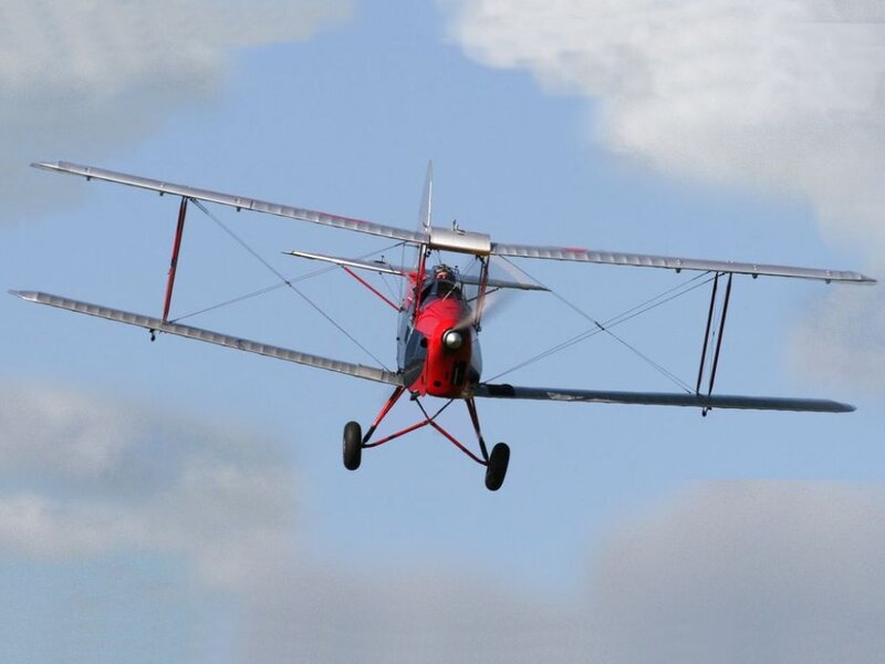 Red Biplane in Flight — Calm