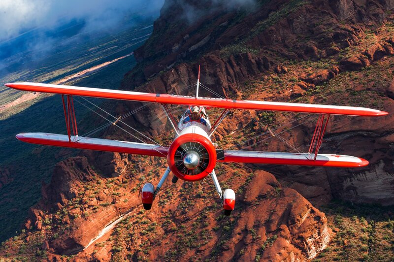 Red Biplane in Flight — Dramatic, Afternoon