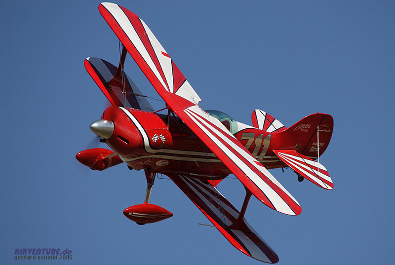 Red Biplane in Flight — Dynamic