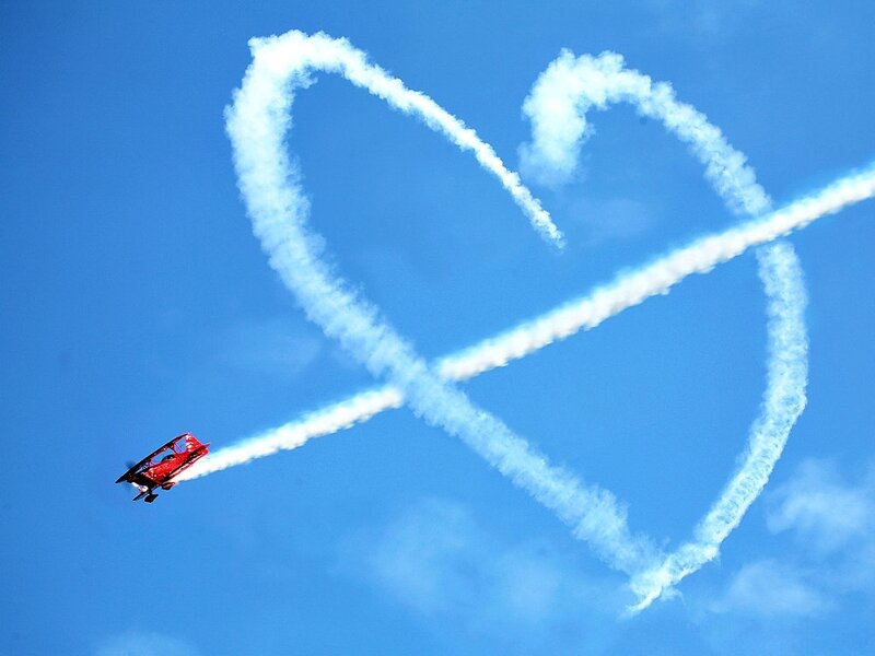 Red Biplane in Sky — Blue, Dramatic