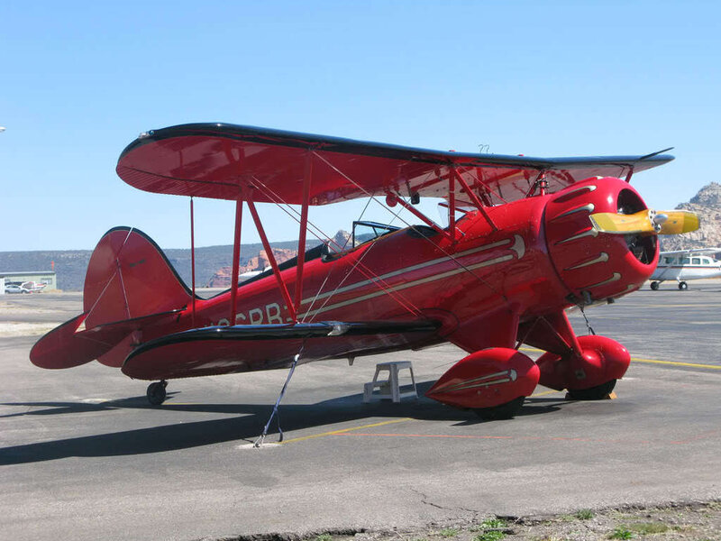 Red Biplane on Tarmac — Clear
