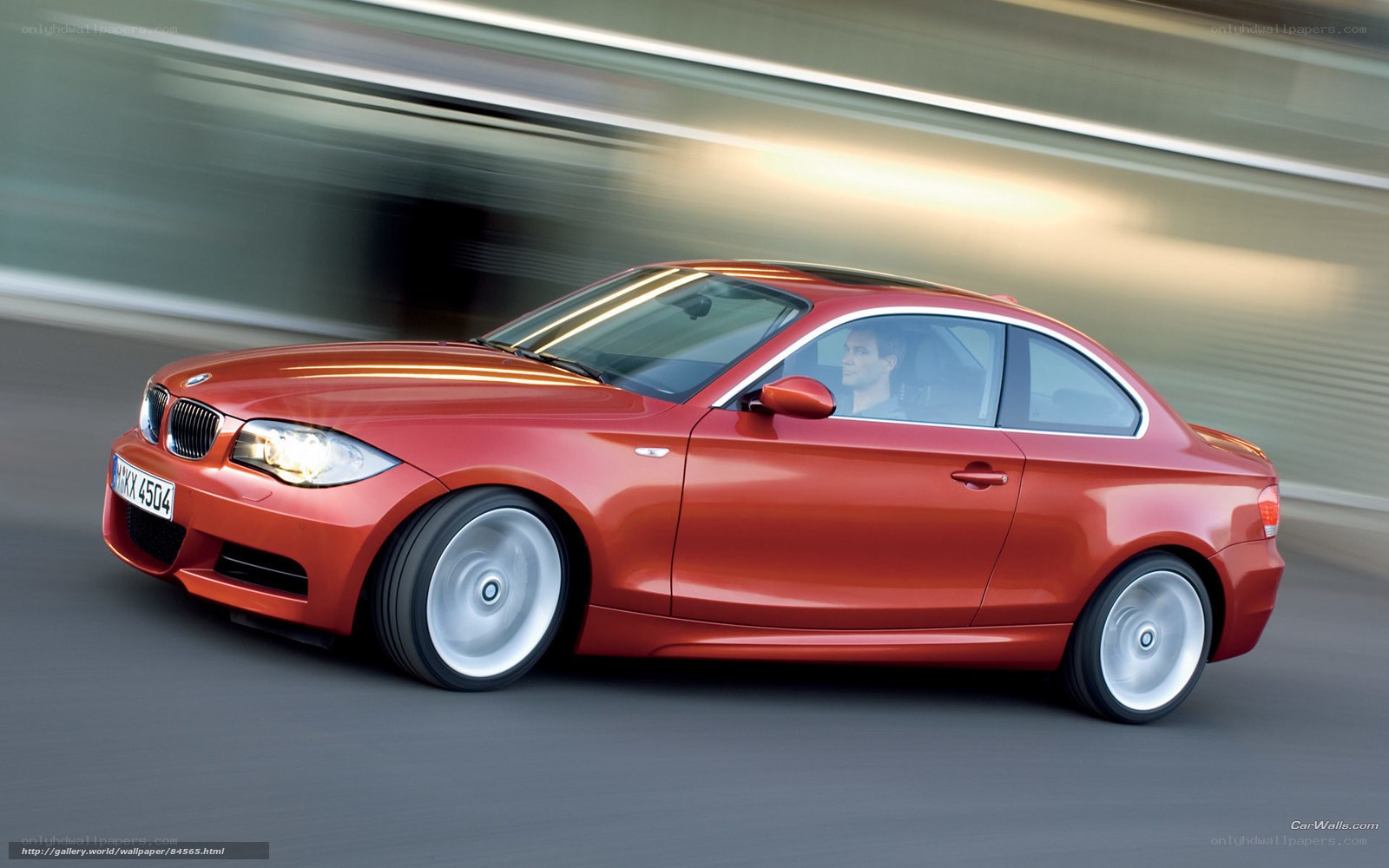 Red BMW 1-Series Coupe in Motion