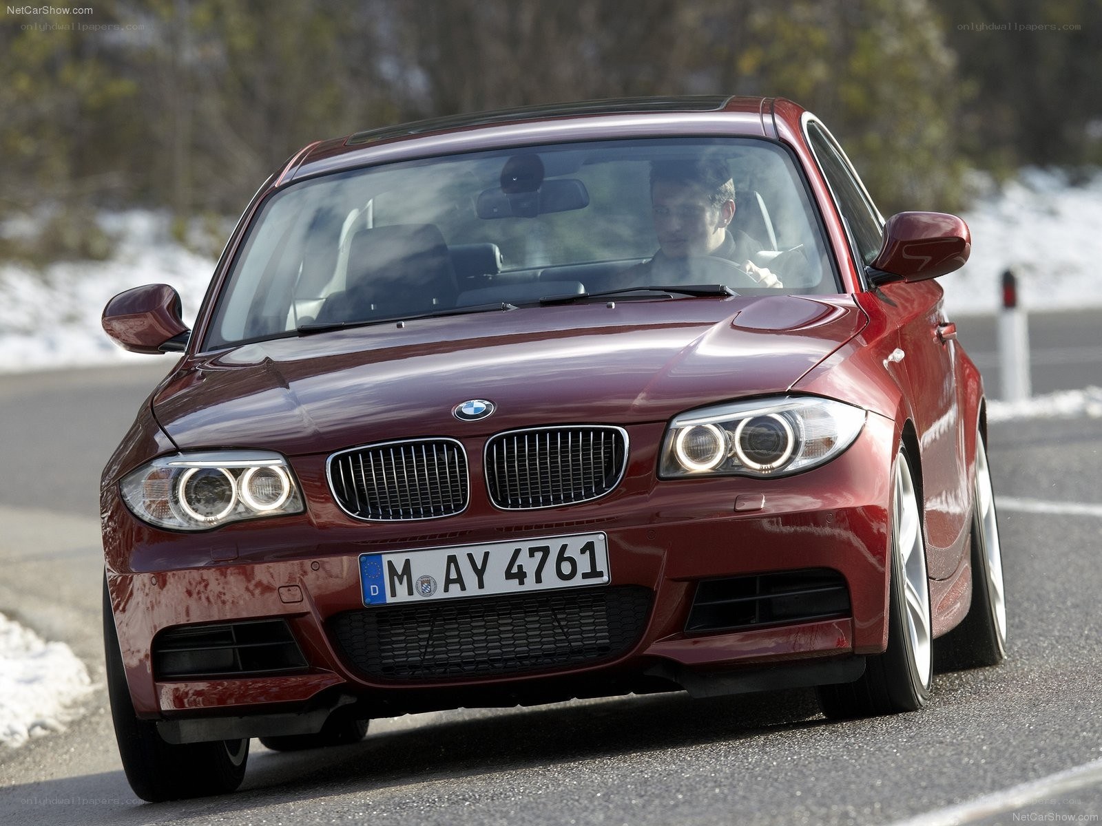 Red BMW 1-Series in motion
