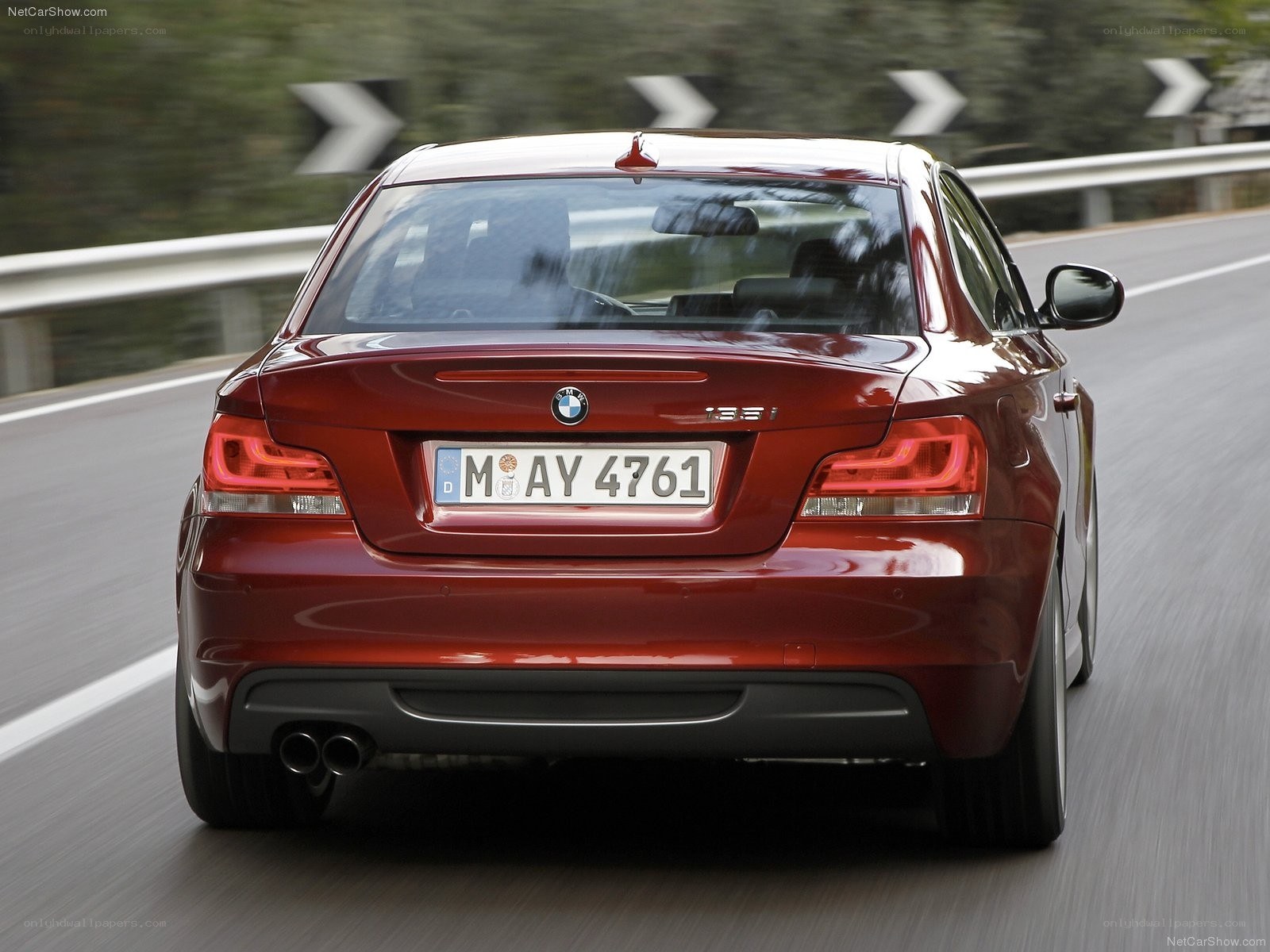 Red BMW 135i in motion