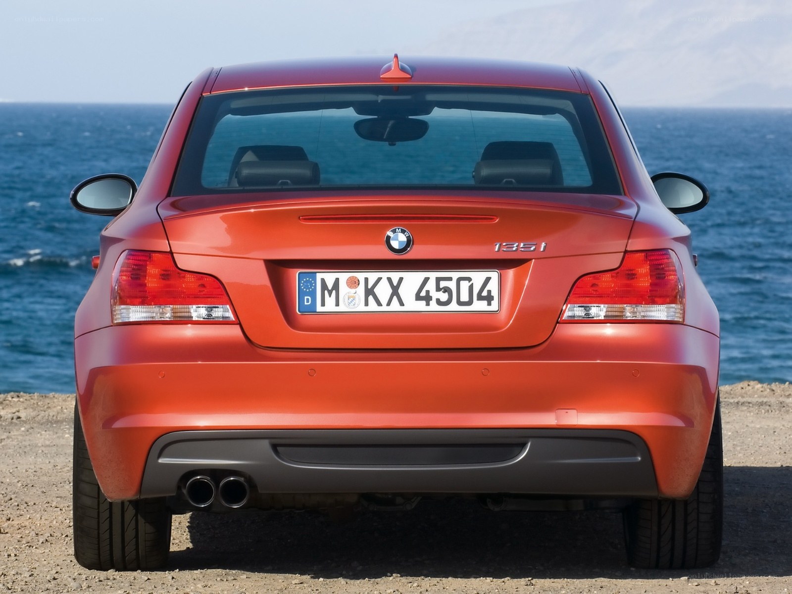 Red BMW 135i rear view