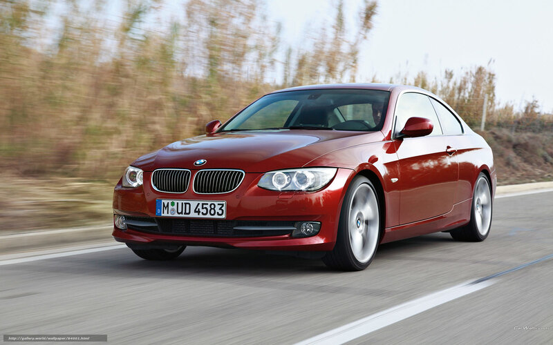 Red BMW 3-Series Coupe in motion