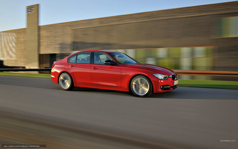 Red BMW 3 Series in motion