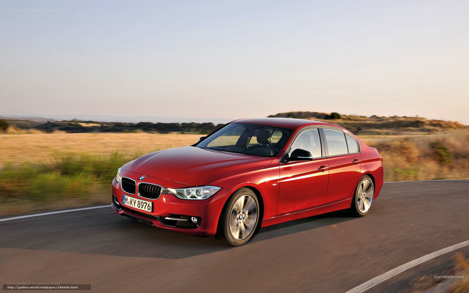 Red BMW 3 Series in motion