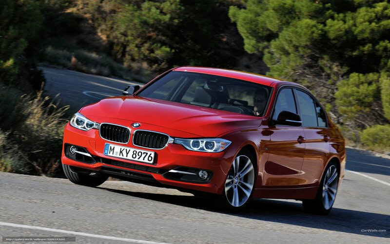 Red BMW 3 Series on a winding road