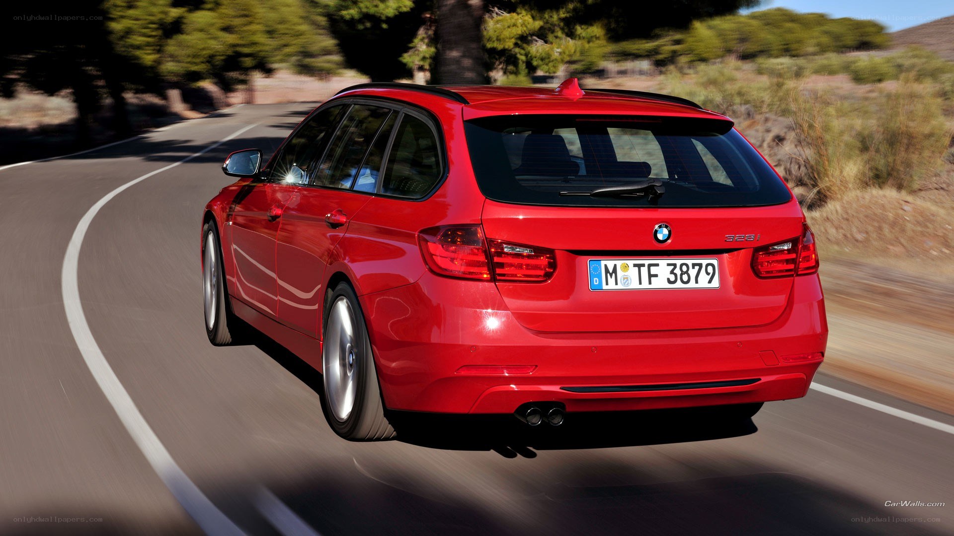 red bmw 328i in motion