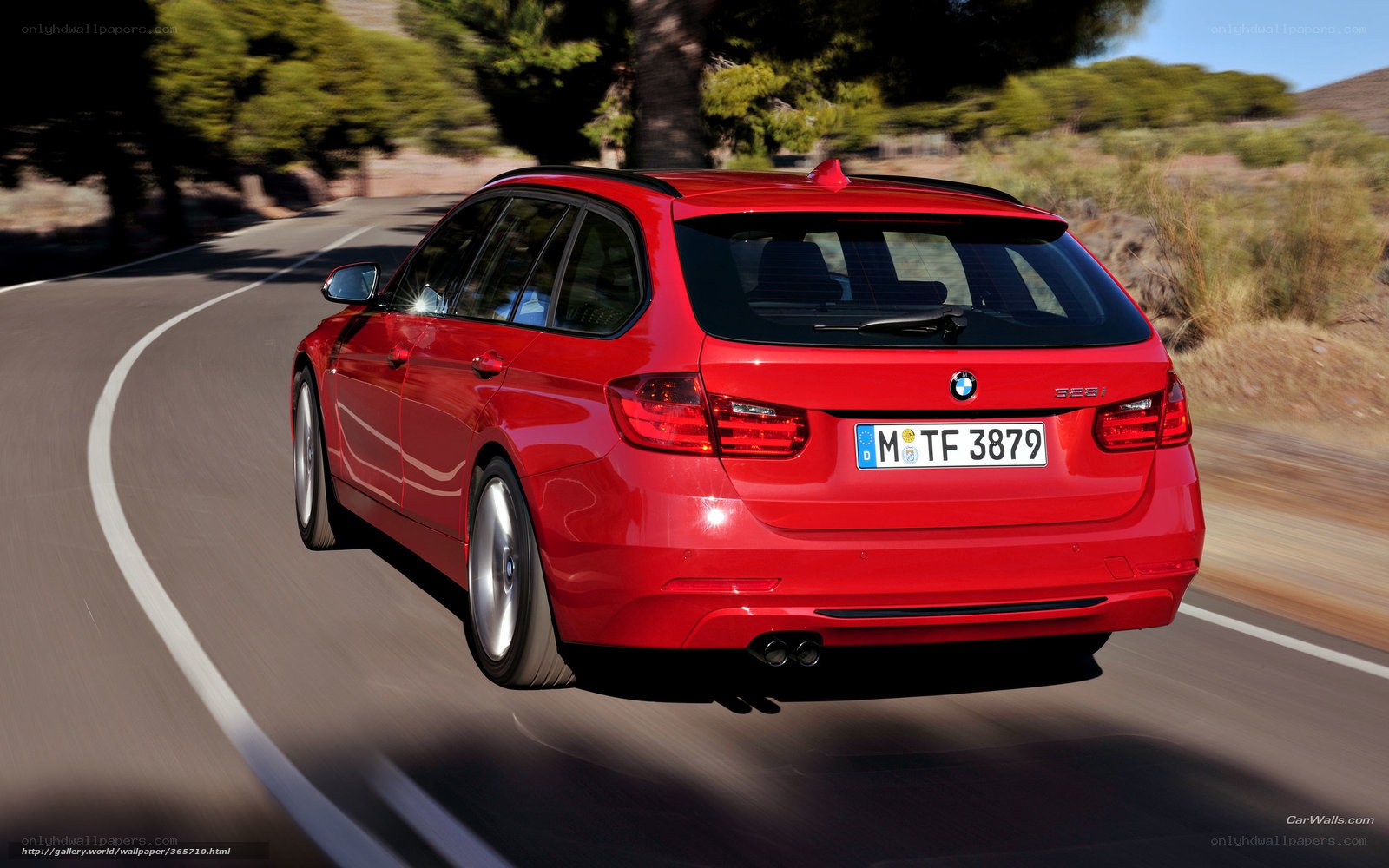 red bmw 328i in motion