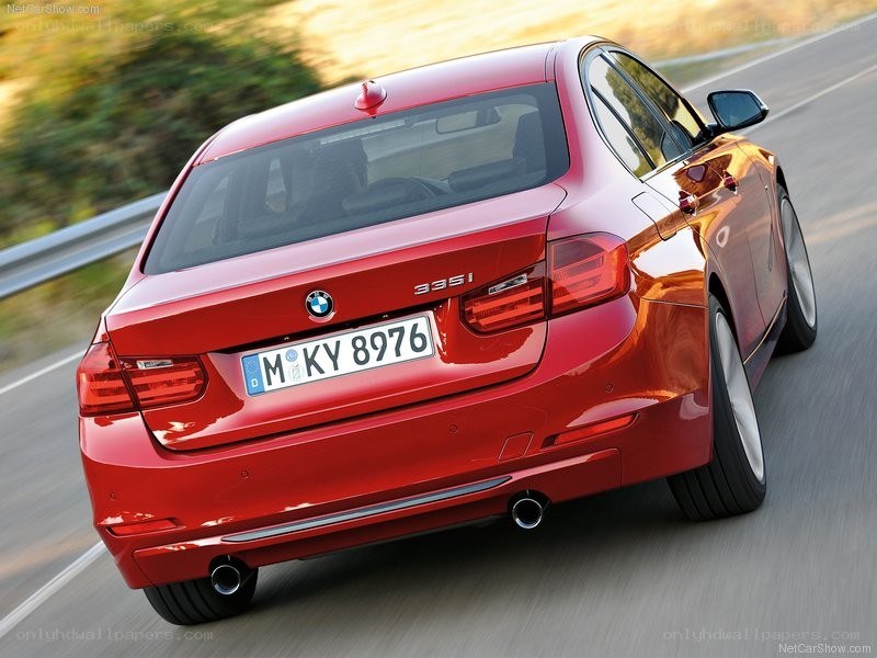 red bmw 335i in motion