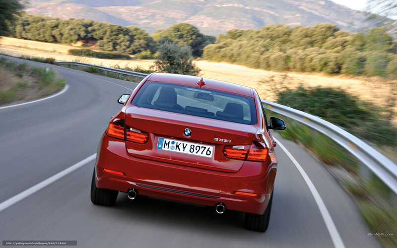 Red BMW 335i on winding road