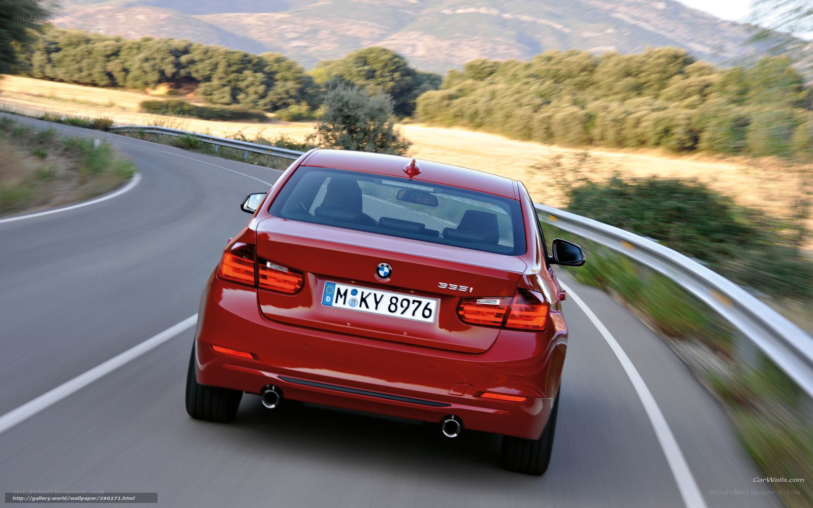 Red BMW 335i on winding road