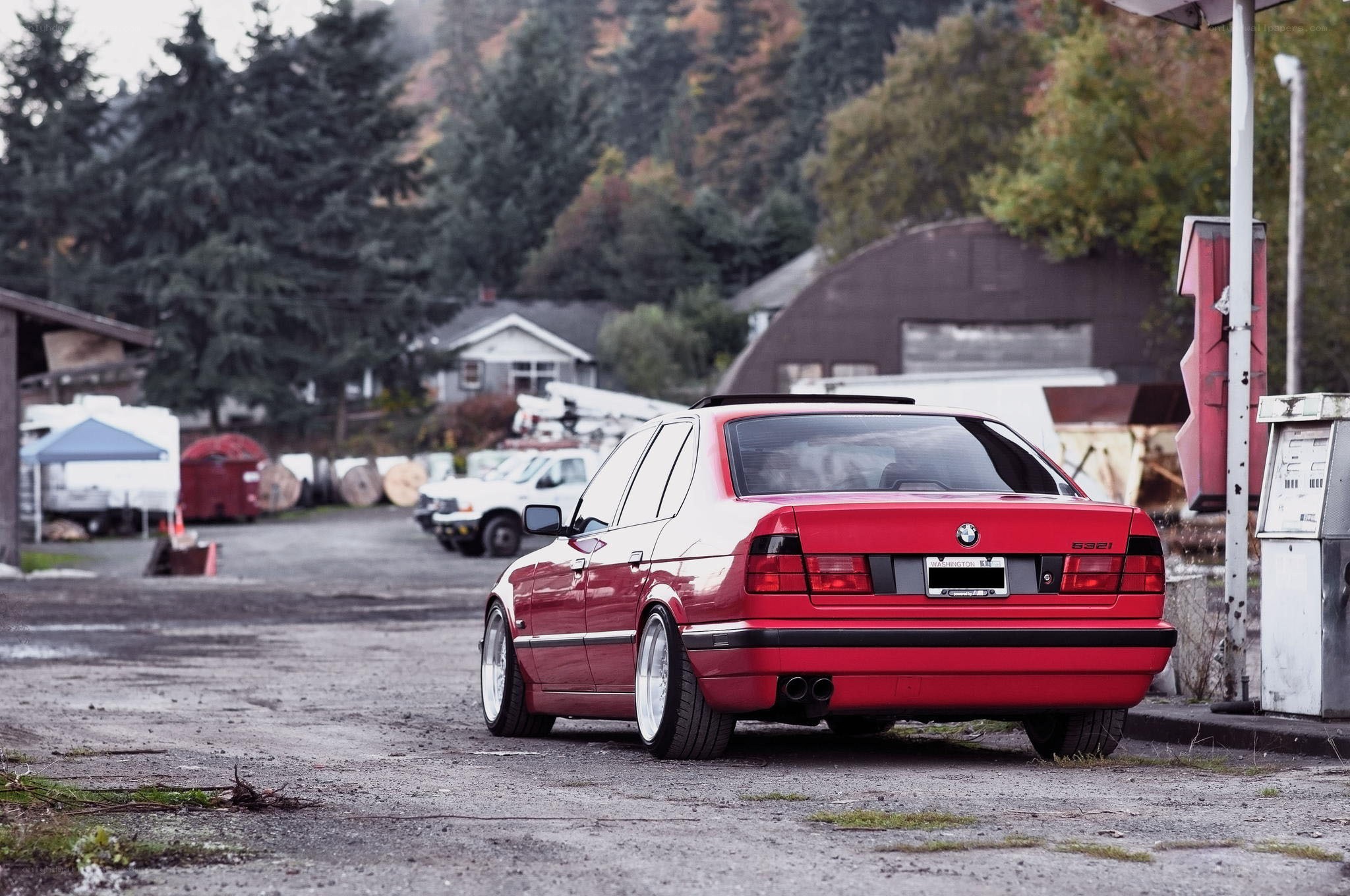 red bmw 532i parked outside