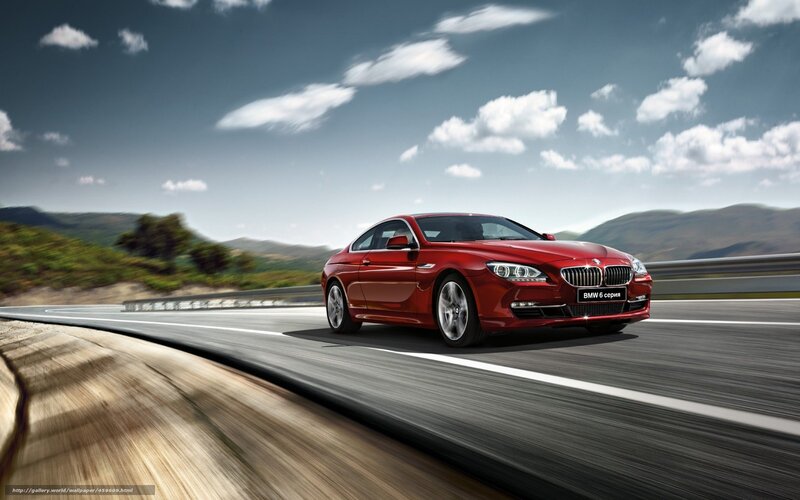 Red BMW 6 Series on a winding road