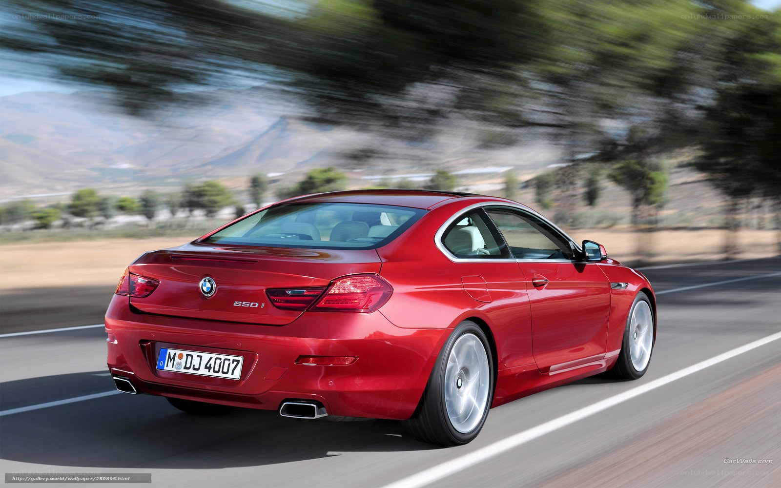 Red BMW 650i in motion