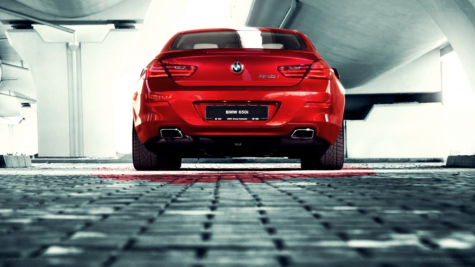 Red BMW 650i rear view