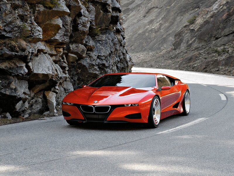 Red BMW concept car on mountain road