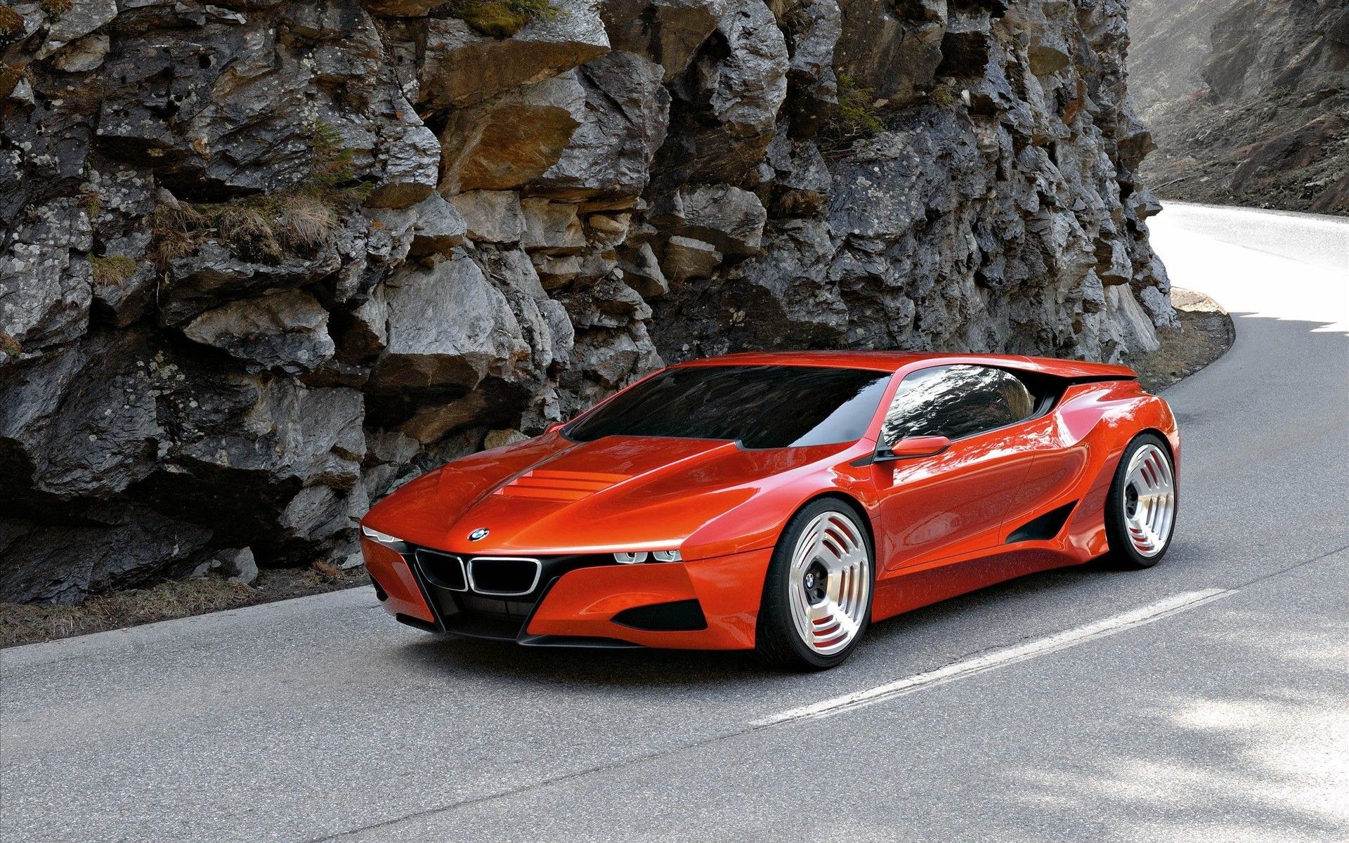 Red BMW concept car on mountain road