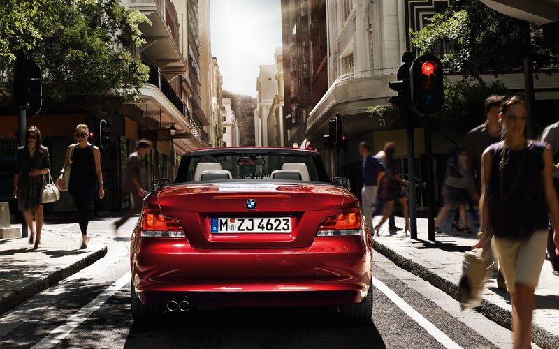 Red BMW convertible in city