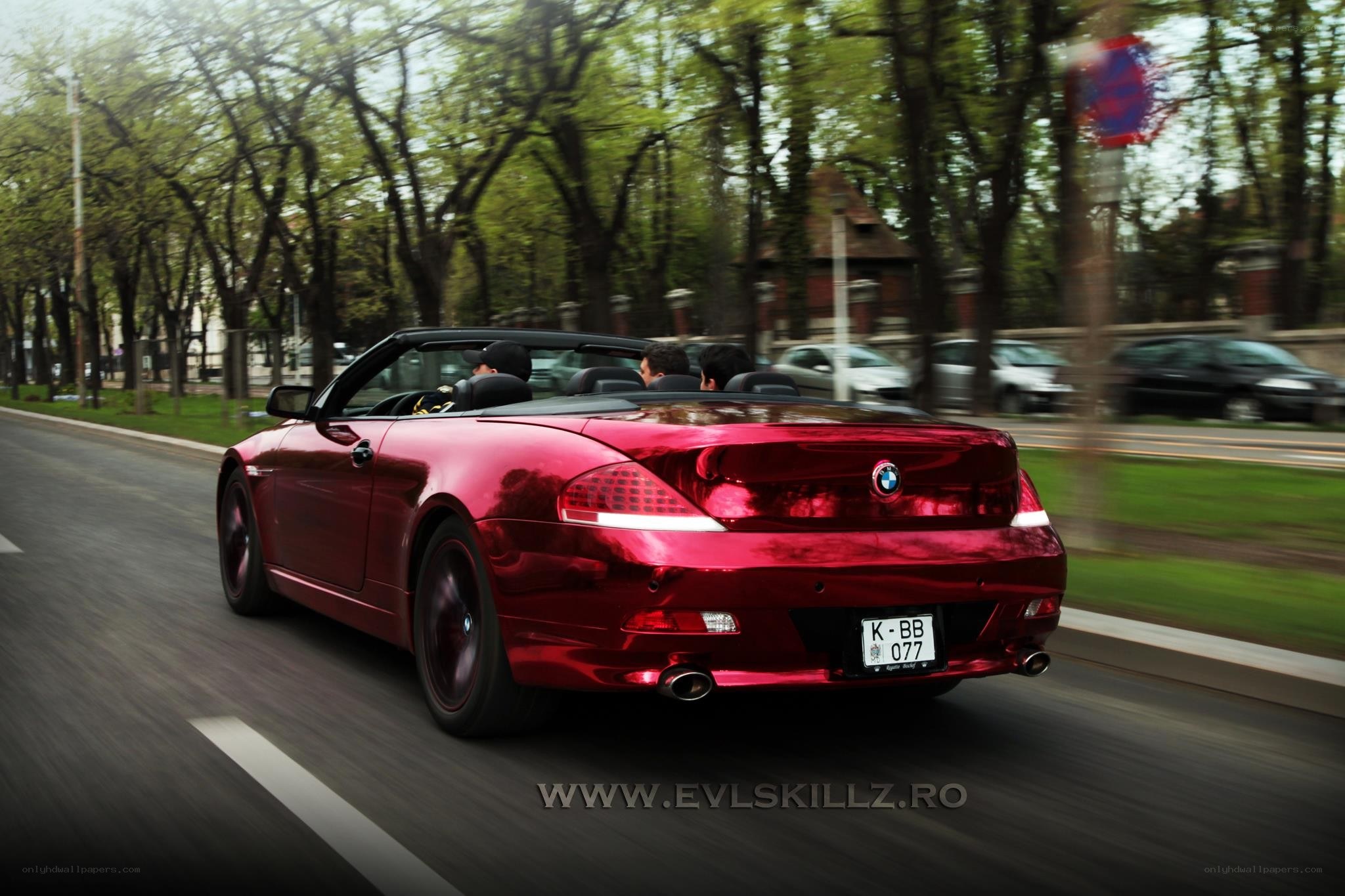 Red BMW convertible in motion