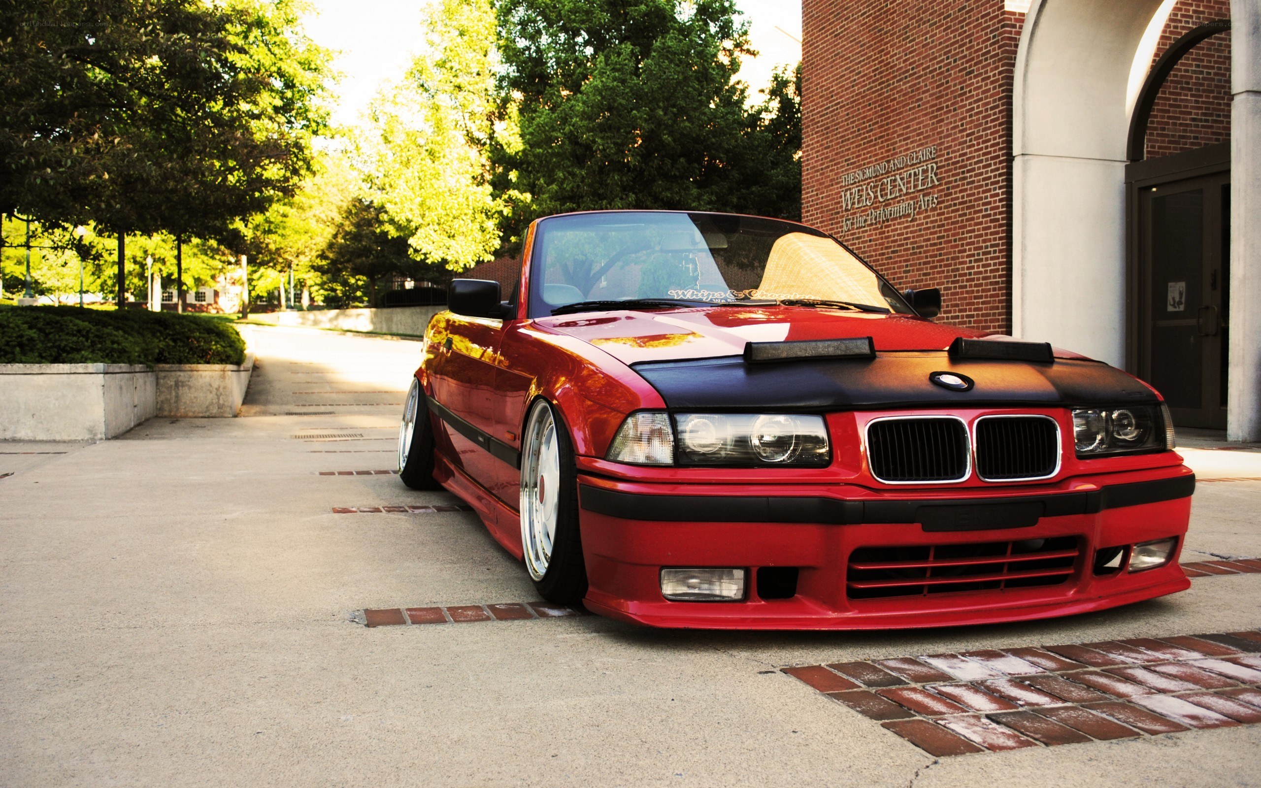 red bmw convertible parked