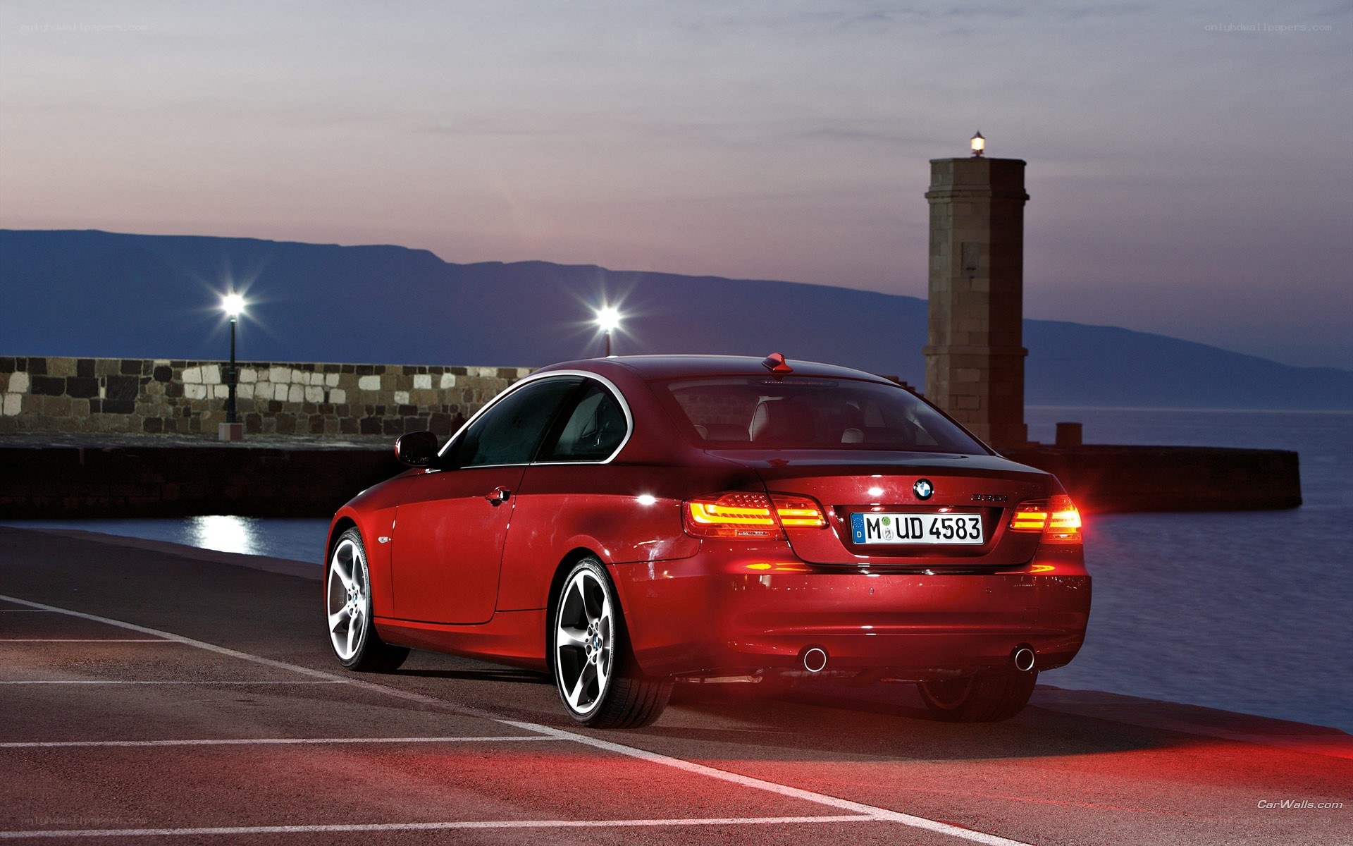 red bmw coupe at harbor