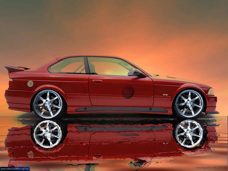 Red BMW coupe at sunset