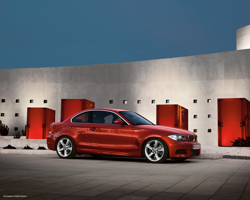 Red BMW coupe in modern setting