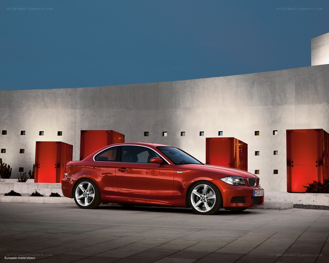 Red BMW coupe in modern setting