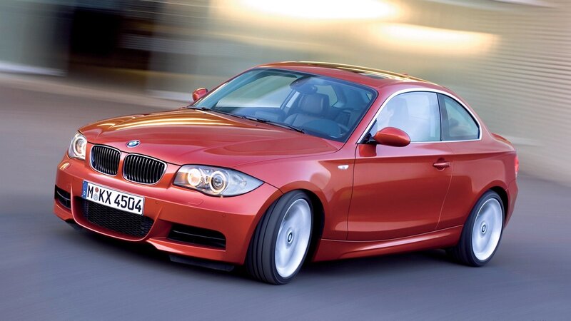 Red BMW coupe in motion