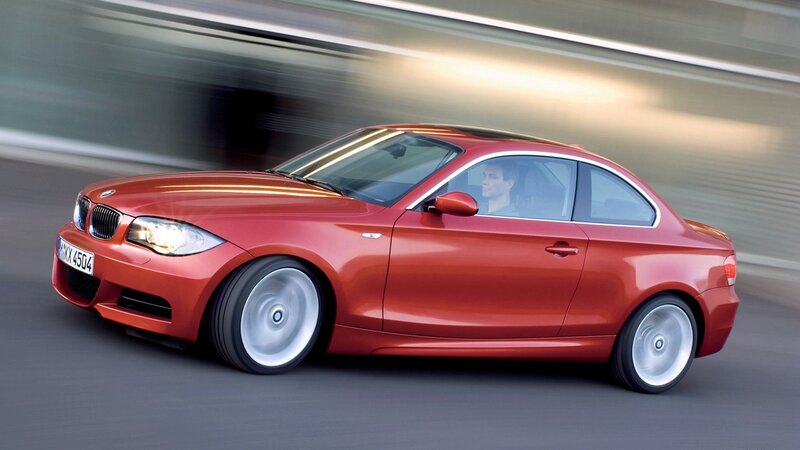 red bmw coupe in motion