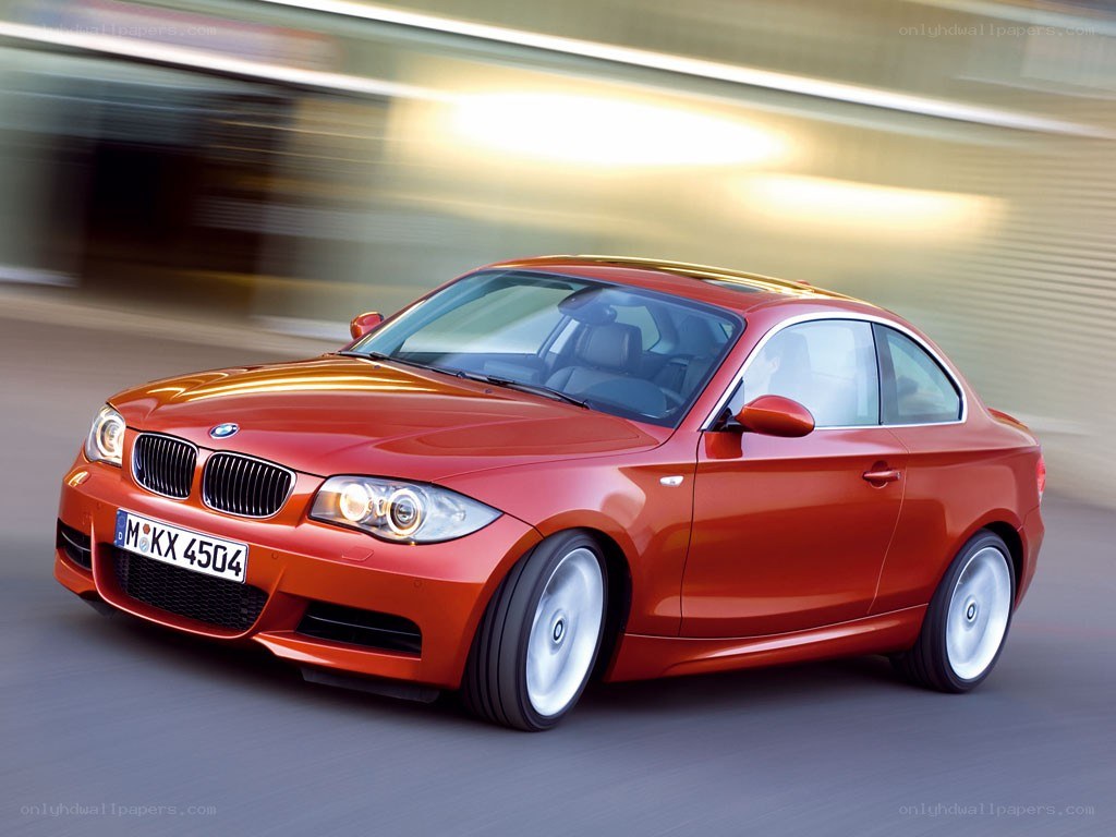 Red BMW coupe in motion