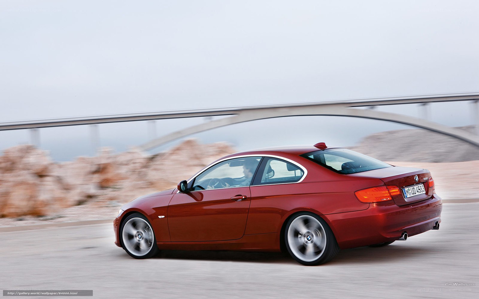 red bmw coupe in motion