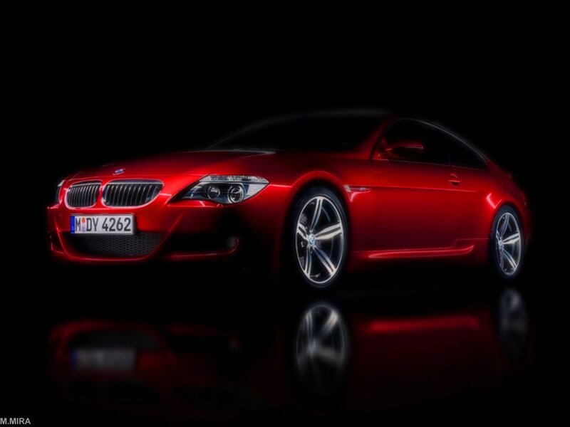 Red BMW coupe in studio