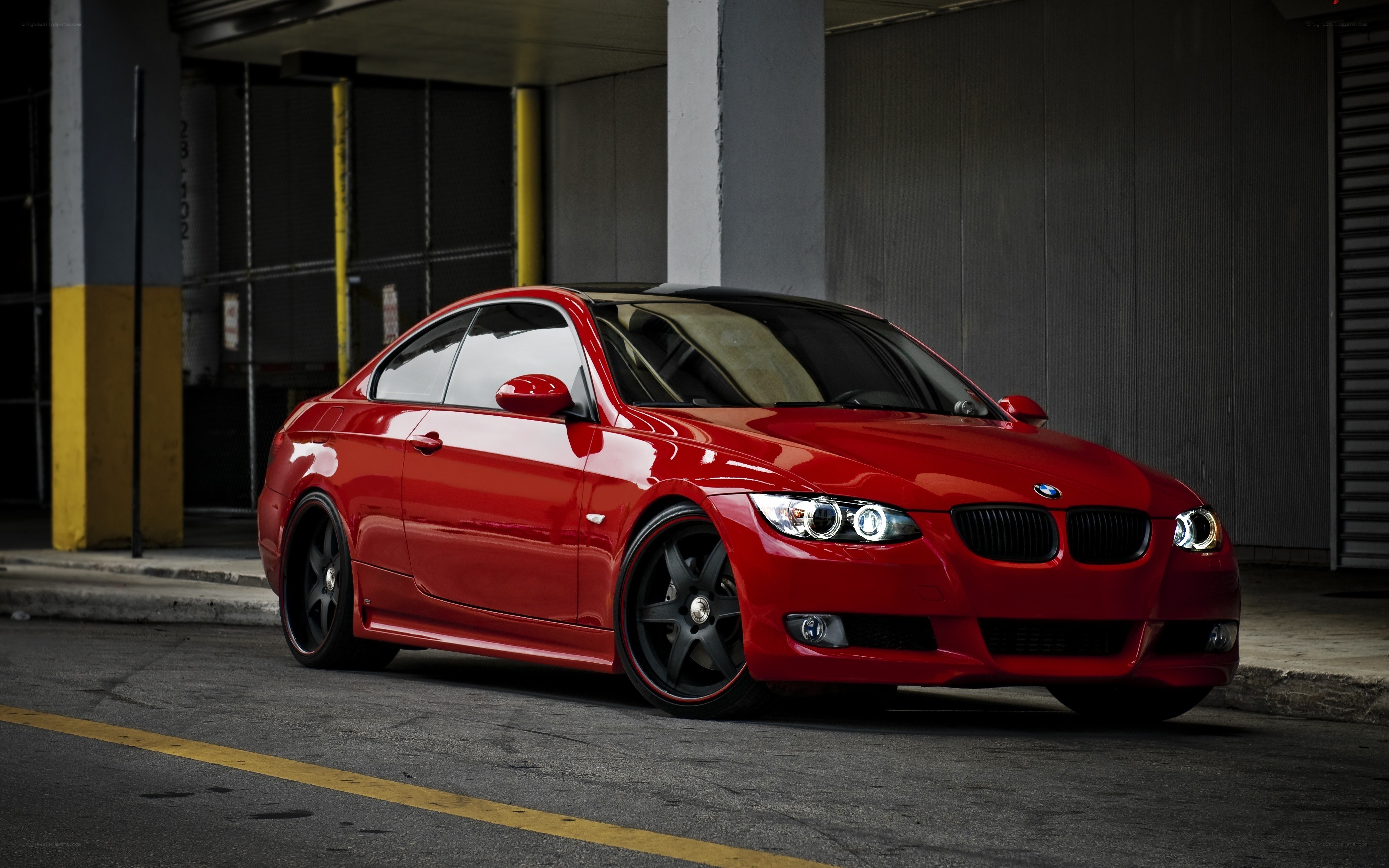 Red BMW coupe in urban setting
