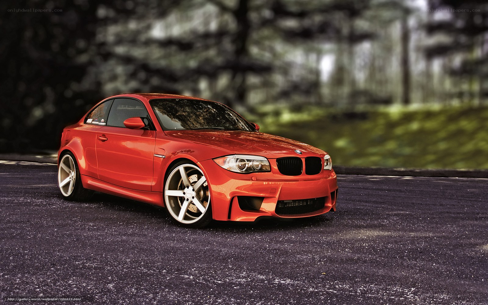 Red BMW coupe on asphalt