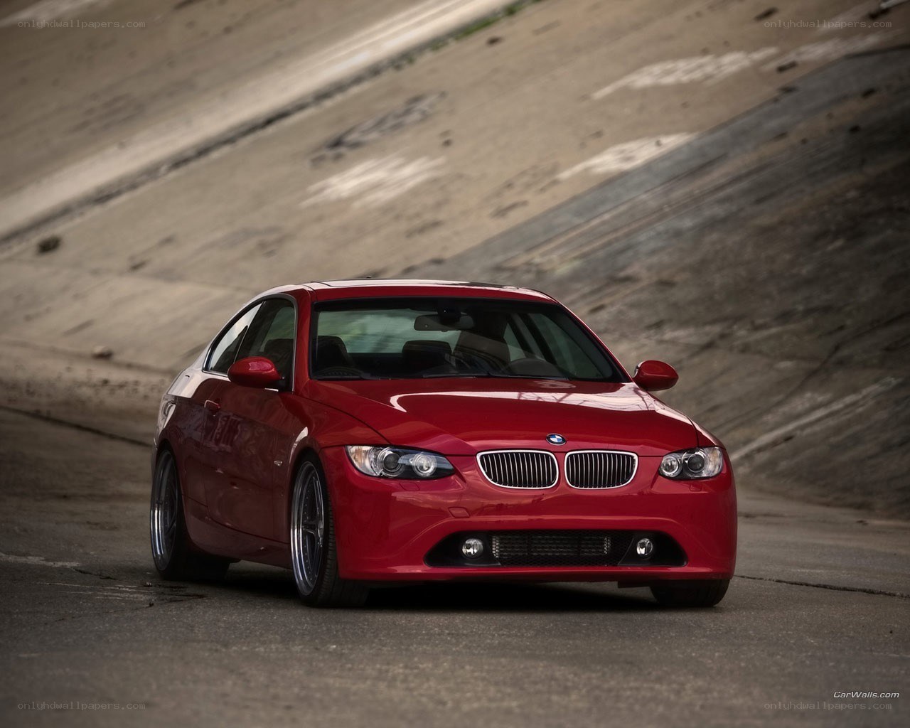 Red BMW coupe on road