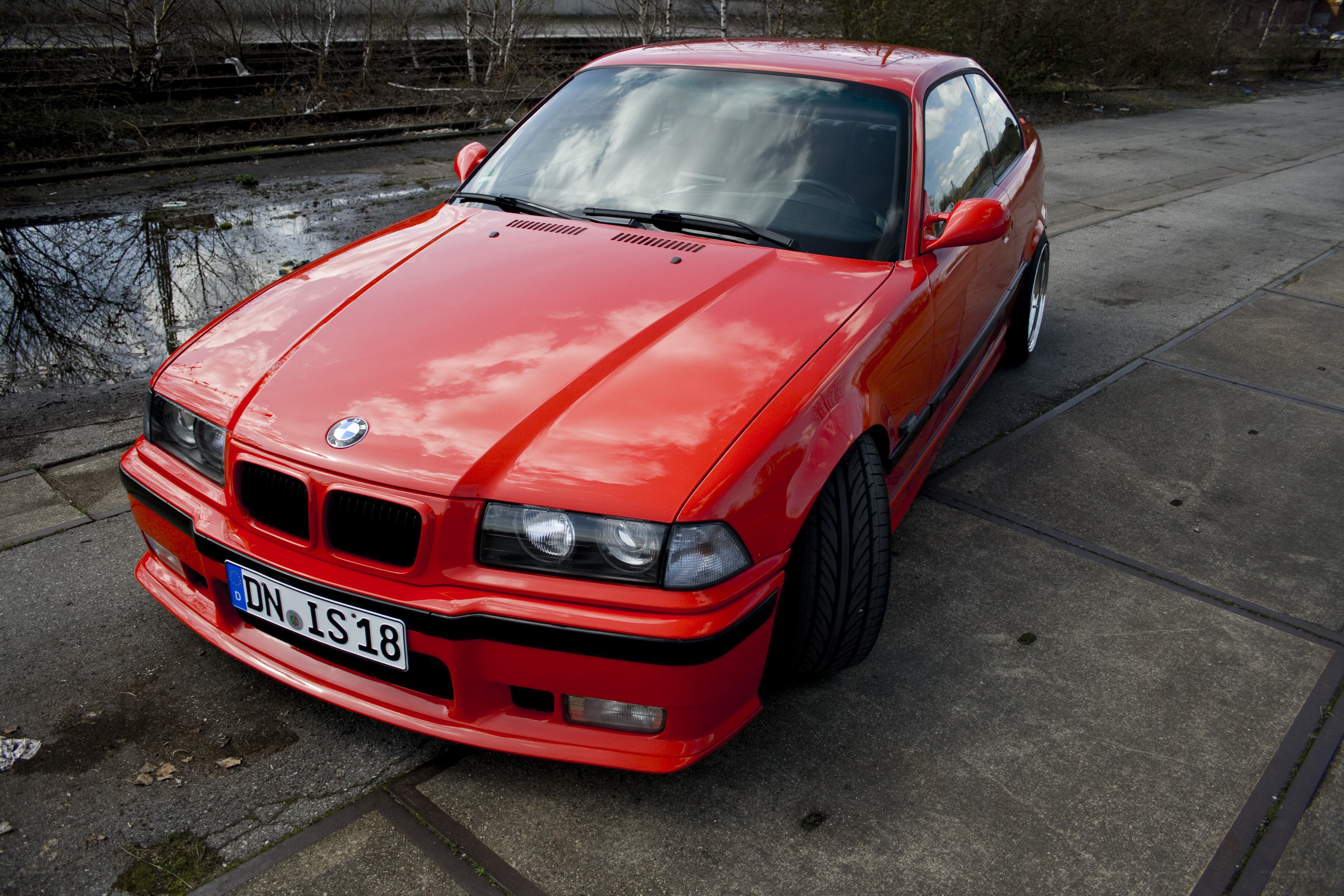 Red BMW coupe parked