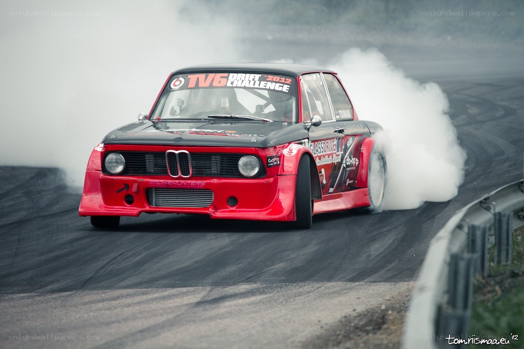Red BMW drifting on track